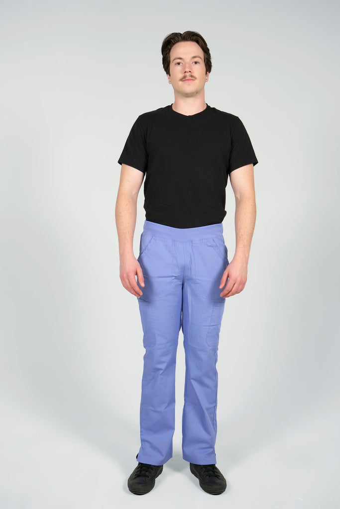 Men's 6-Pocket Elastic Scrub Pant in Periwinkle front view on model wearing black top