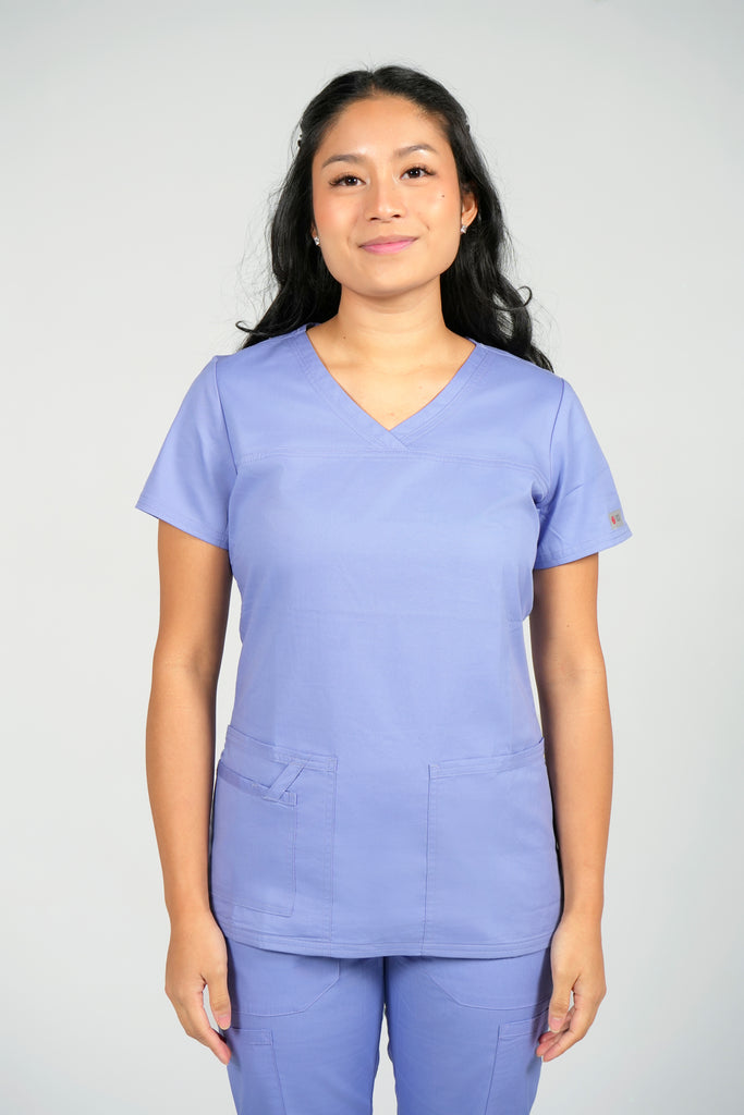 Women's Tailored 4-Pocket V-Neck Scrub Top in Periwinkle front view on model