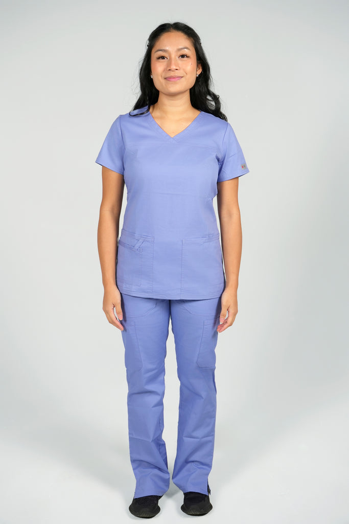 Women's Tailored 4-Pocket V-Neck Scrub Top in Periwinkle front view on model wearing matching periwinkle scrub pants