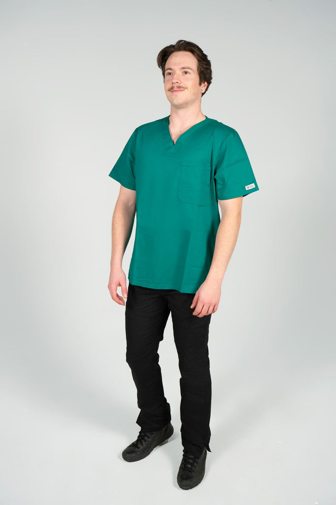 Men's 2-Pocket V-Neck Scrub Top in Forest Green front view on model wearing black scrub pants