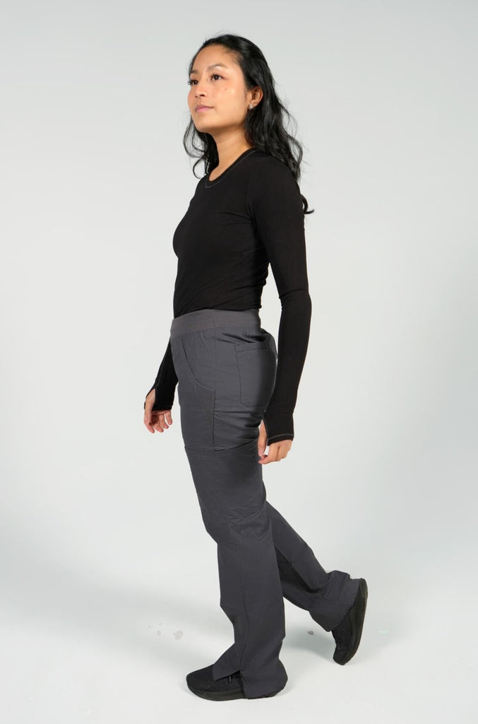 Women's 6-Pocket Elastic Scrub Pant in Charcoal sideview on model wearing black underscrub top