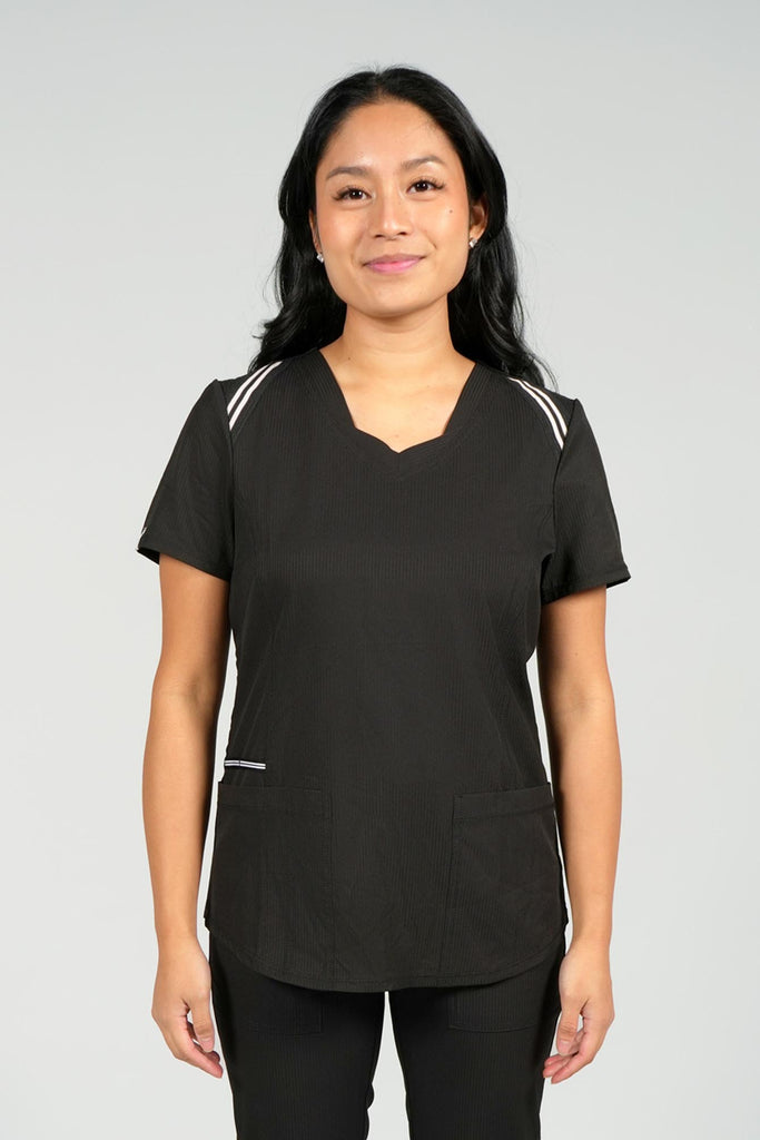 Women's Active Striped Scrub Top in Black front view on model