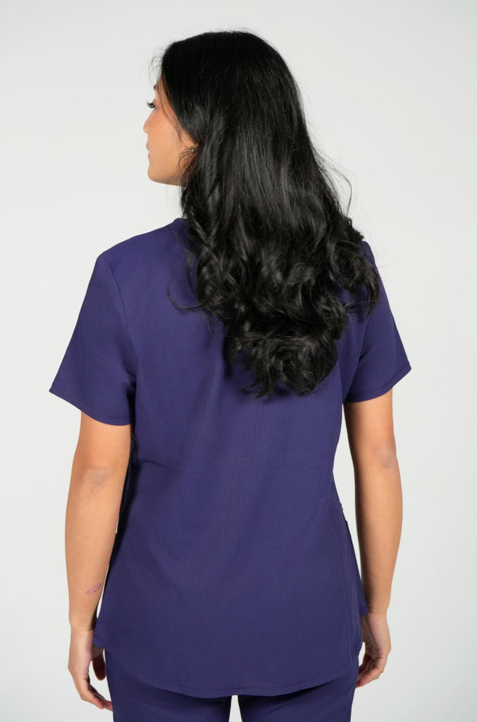 Women's Active Striped Scrub Top in navy back view on model