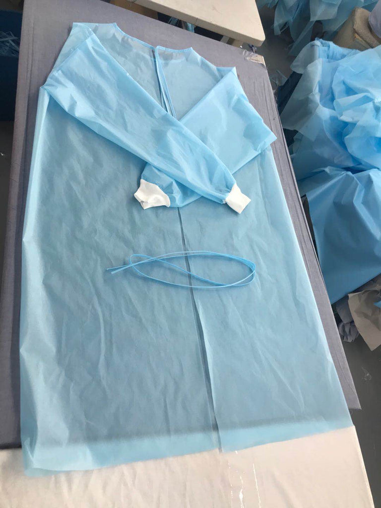 Disposable Isolation Gown, AAMI Level 3 flat view on table with tie closure