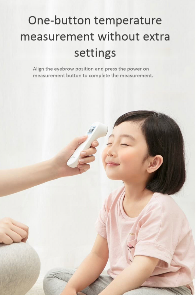 Yuwell Infrared Forehead Thermometer being used on girl