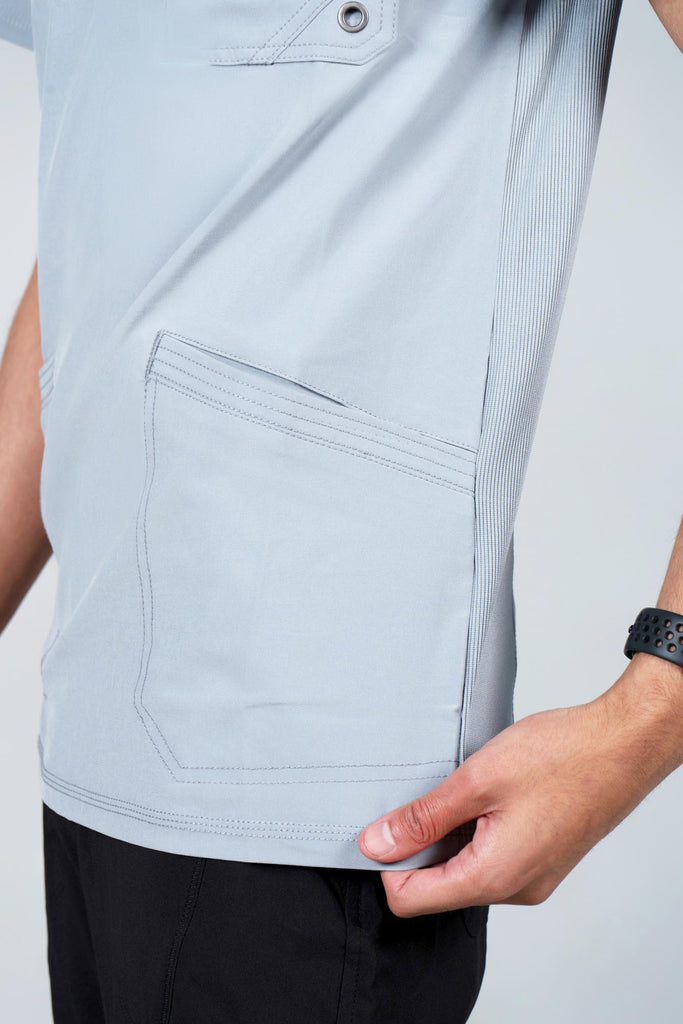Men's Performance Scrub Top in Light Grey closeup on bottom angled pocket