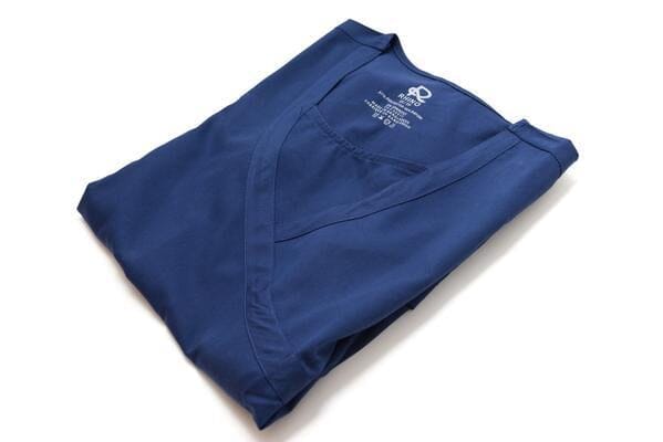 Women’s premium Flex 3-Pocket Scrub Top in shade navy folded sideview