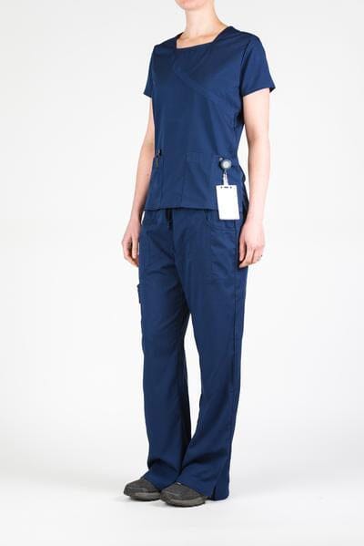 Women’s premium Flex 3-Pocket Scrub Top in shade navy paired with matching scrub set women's Flex Pants in shade navy front view