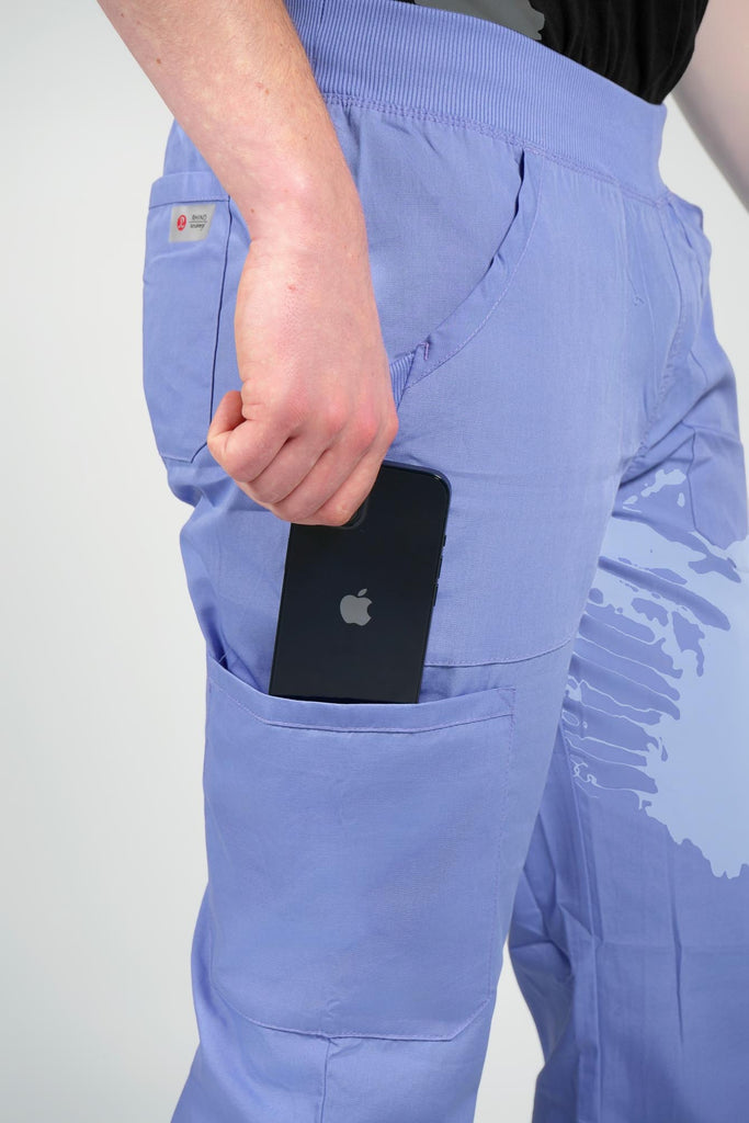 Men's 6-Pocket Elastic Scrub Pant in Periwinkle closeup on model putting phone into pocket