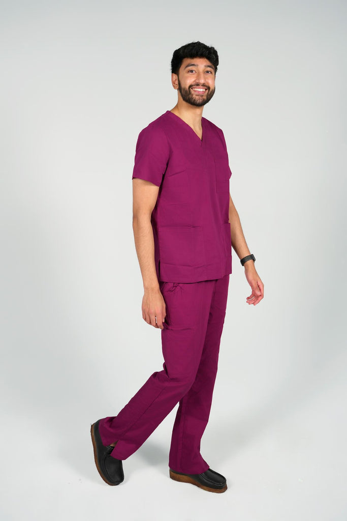 Men's 3-Pocket Scrub Top in Wine side view on model wearing matching wine scrub pants