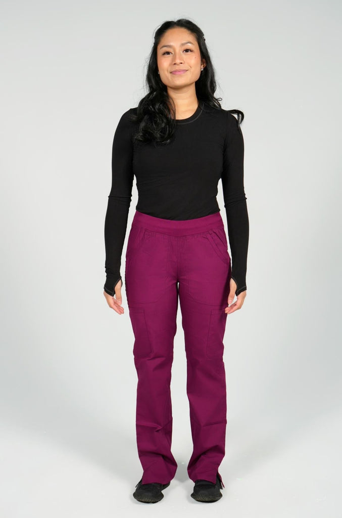 Women's 6-Pocket Elastic Scrub Pant in Wine front view on model wearing black underscrub top