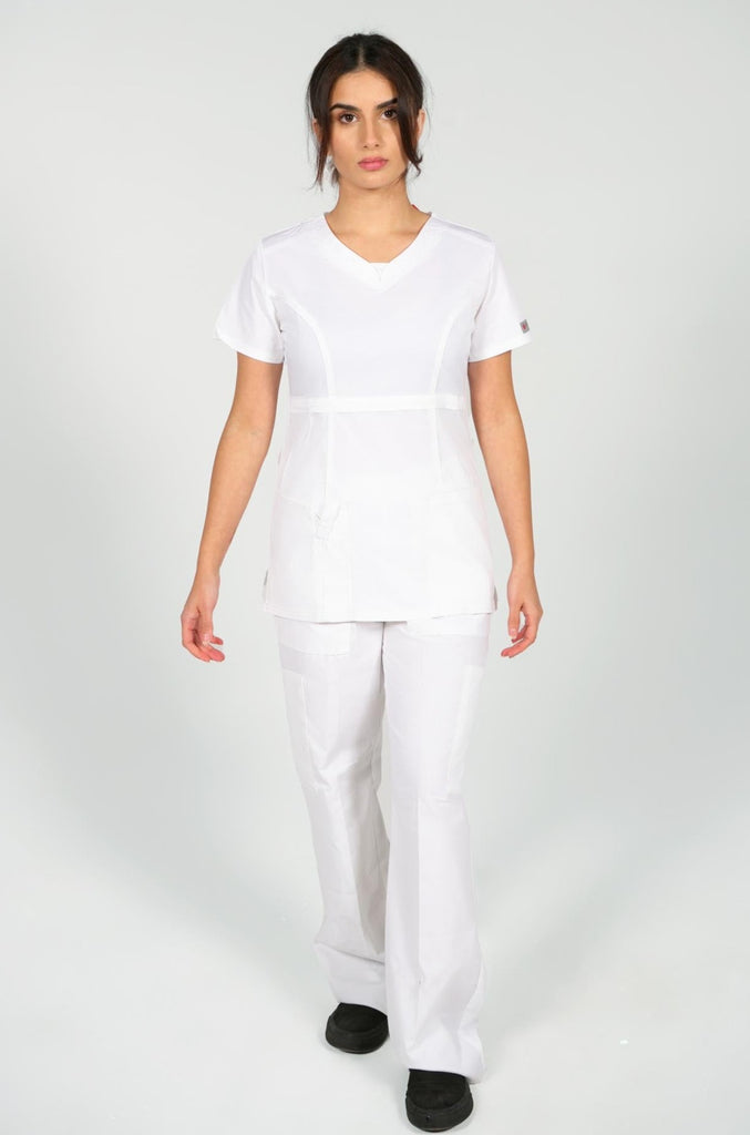 Women's 4-Pocket Curved V-Neck Scrub Top in White front view on model with matching white scrub pants