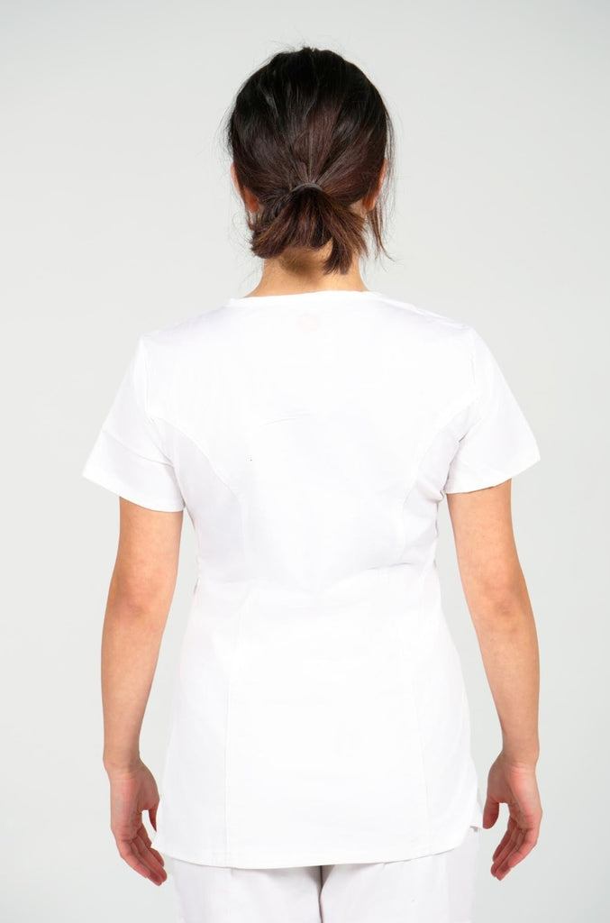Women's 4-Pocket Curved V-Neck Scrub Top in White back view on model