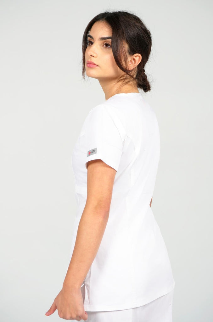 Women's 4-Pocket Curved V-Neck Scrub Top in White side view on model