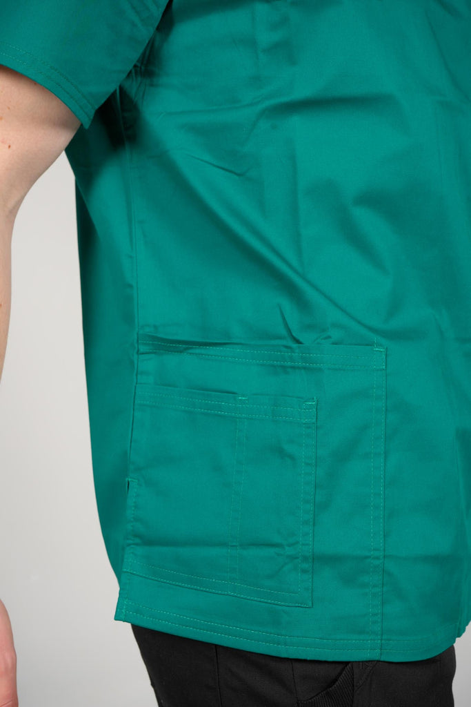 Men's 4-Pocket Scrub Top in Forest Green closeup on bottom pockets