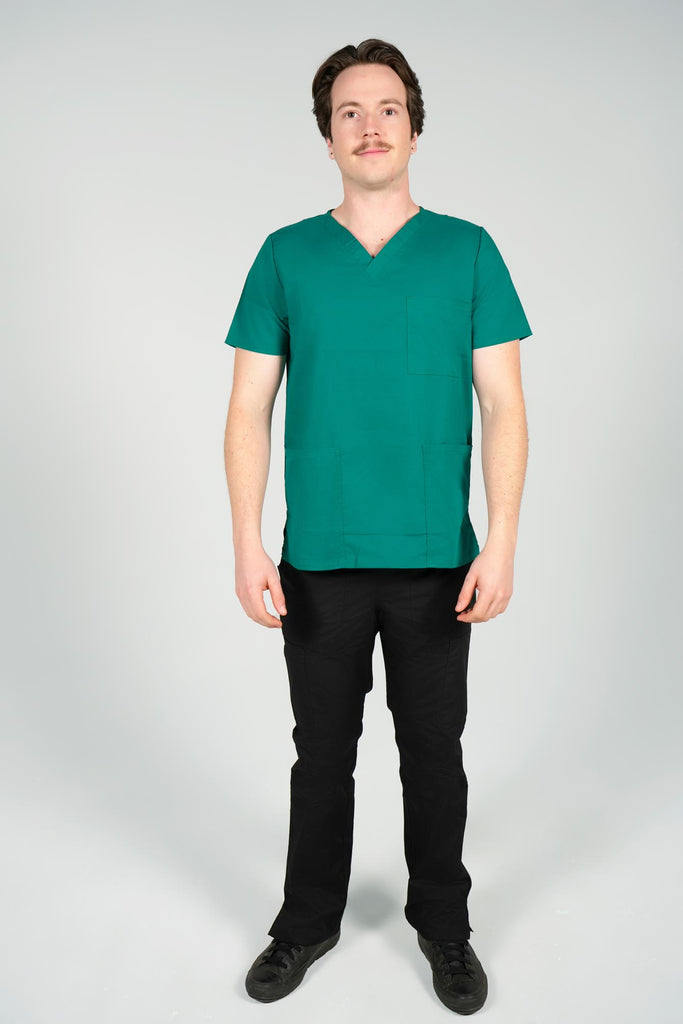 Men's 3-Pocket Scrub Top in Forest Green front view on model wearing black scrub pants