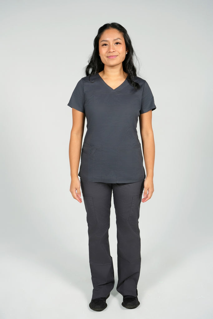 Women's Tailored 4-Pocket V-Neck Scrub Top in Charcoal on model wearing matching charcoal scrub pants