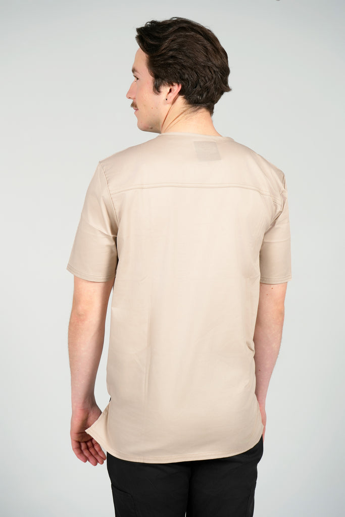 Men’s 2-Pocket V-Neck Scrub Top in Beige back view on model