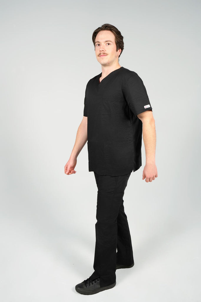 Men's 4-Pocket Scrub Top in black sideview on model wearing black scrub pants