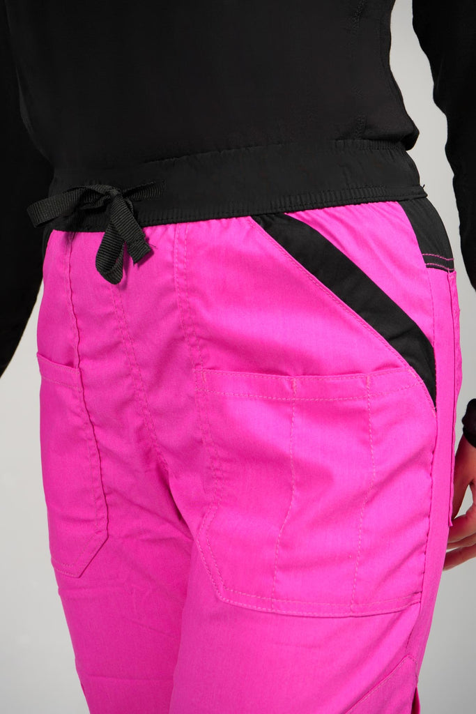 Women's 14-Pocket Cargo Scrub Jogger in shade pink closeup view of black elastic waistband with drawstring