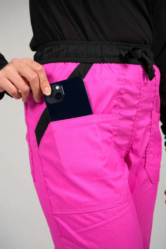 woman pulling phone out of pocket from cargo scrub jogger