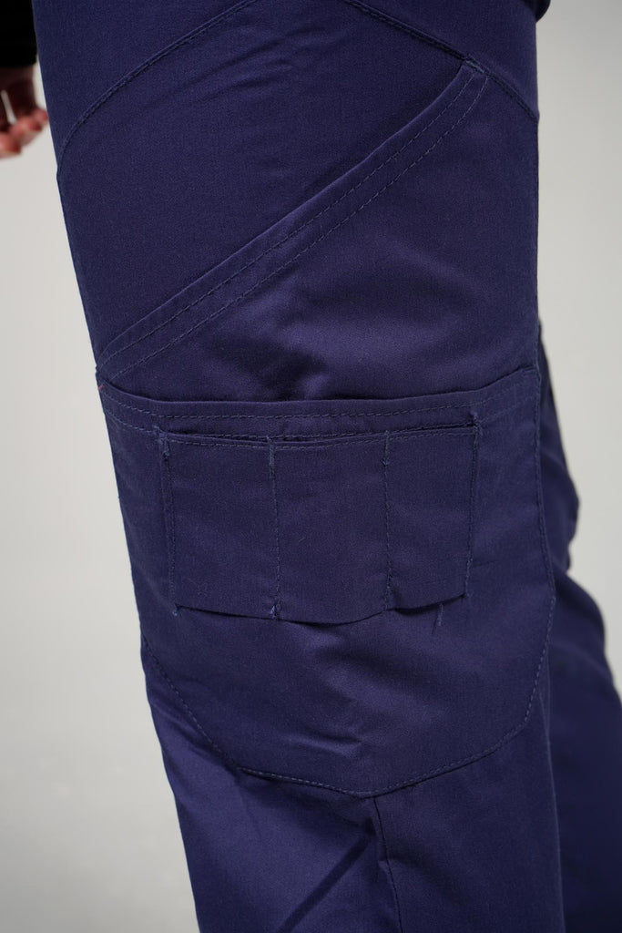 Women's 14-Pocket Cargo Scrub Jogger in shade navy cargo pocket close up view with additional utility pockets
