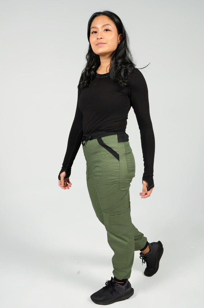 Women's 14-Pocket Cargo Scrub Jogger in shade olive side view with matching black underscrub top