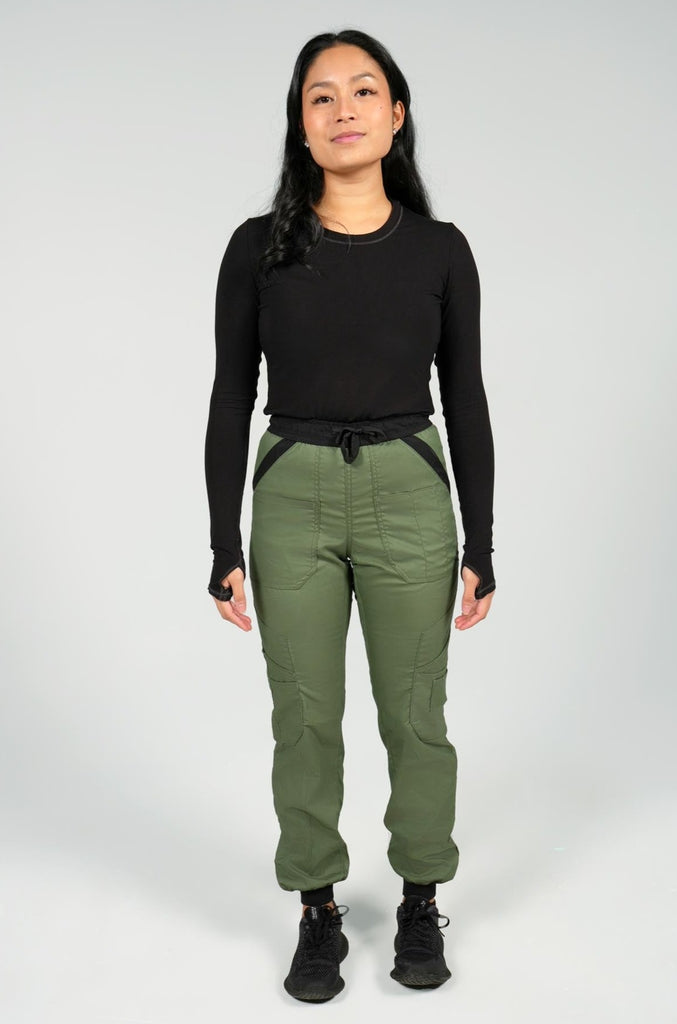 Women's 14-Pocket Cargo Scrub Jogger in shade olive front view with matching black underscrub top
