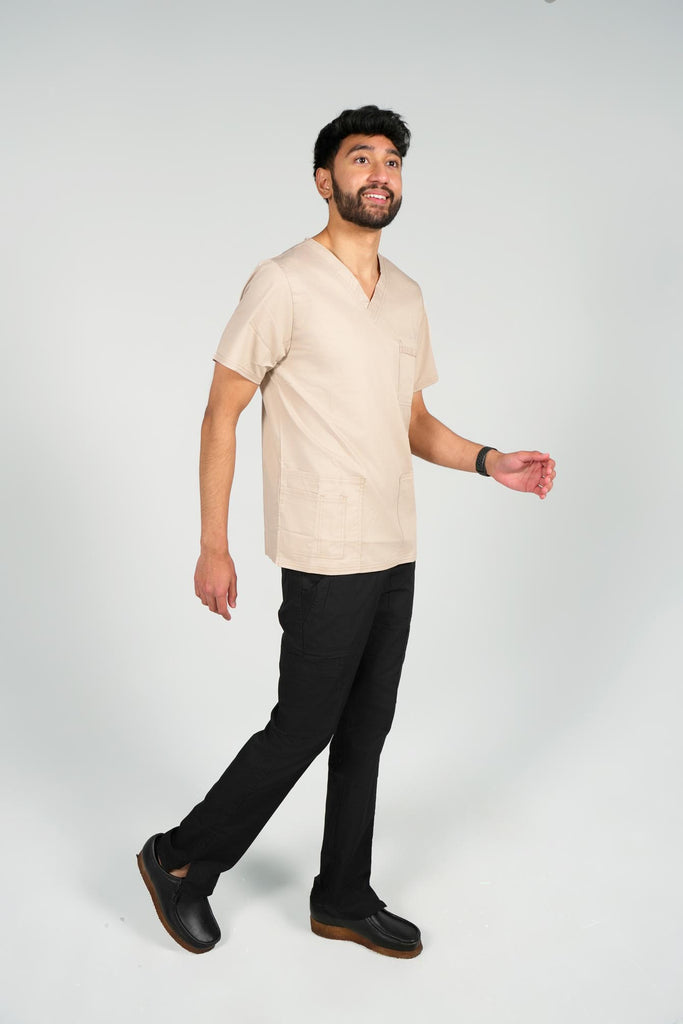 Men's 4-Pocket Scrub Top in beige sideview on model wearing black scrub pants