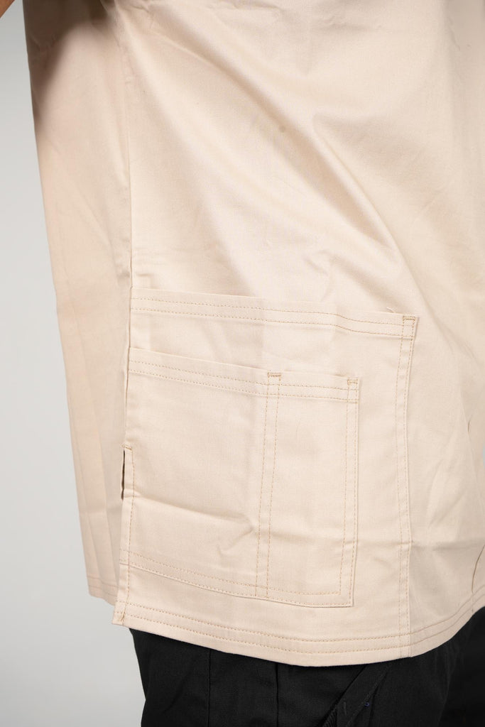 Men's 4-Pocket Scrub Top in beige closeup on bottom pockets