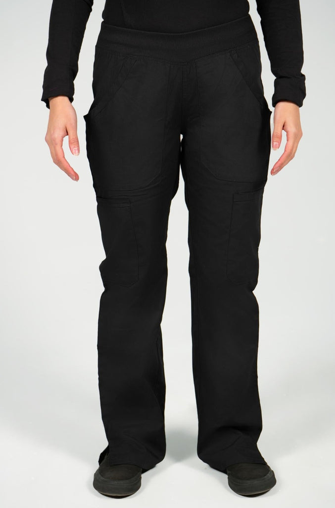Women's 6-Pocket Elastic Scrub Pant in Black front view on model