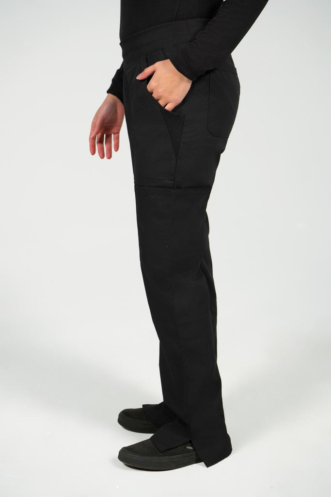 Women's 6-Pocket Elastic Scrub Pant in Black side view on model