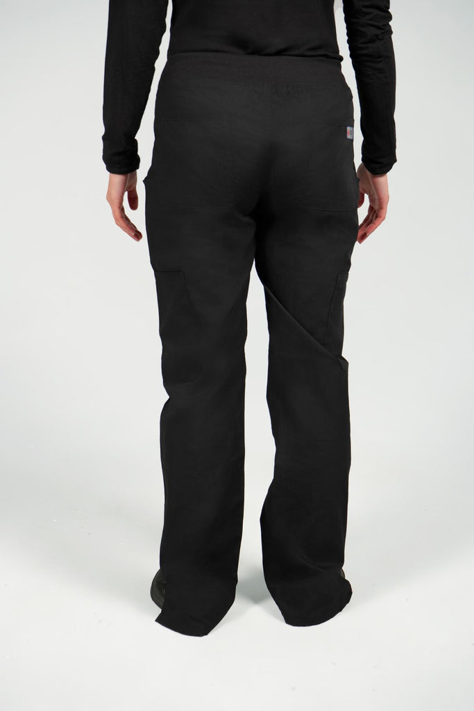 Women's 6-Pocket Elastic Scrub Pant in Black back view on model