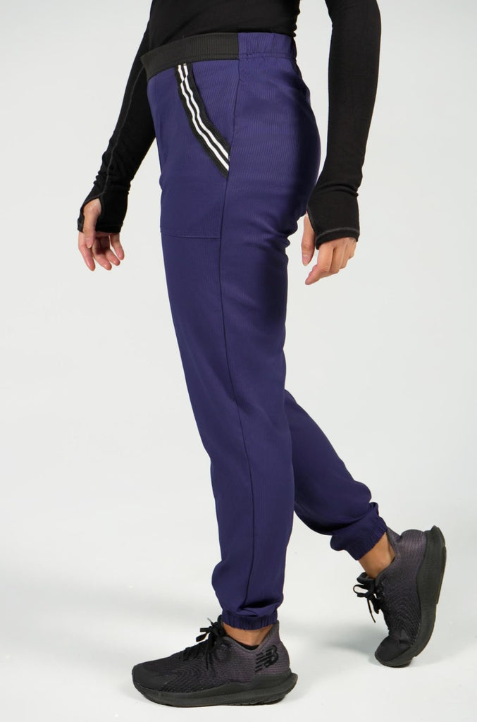 Women's Active Striped Scrub Jogger in navy side view on model