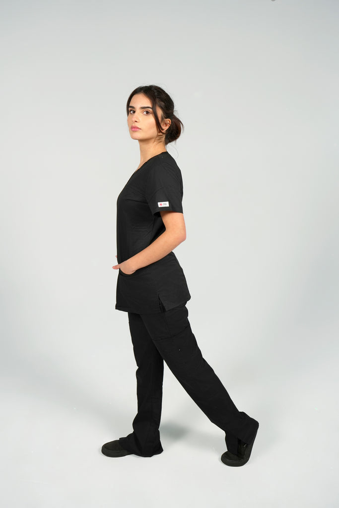 Women's Tailored 4-Pocket V-Neck Scrub Top in Black side view on model wearing black scrub pants