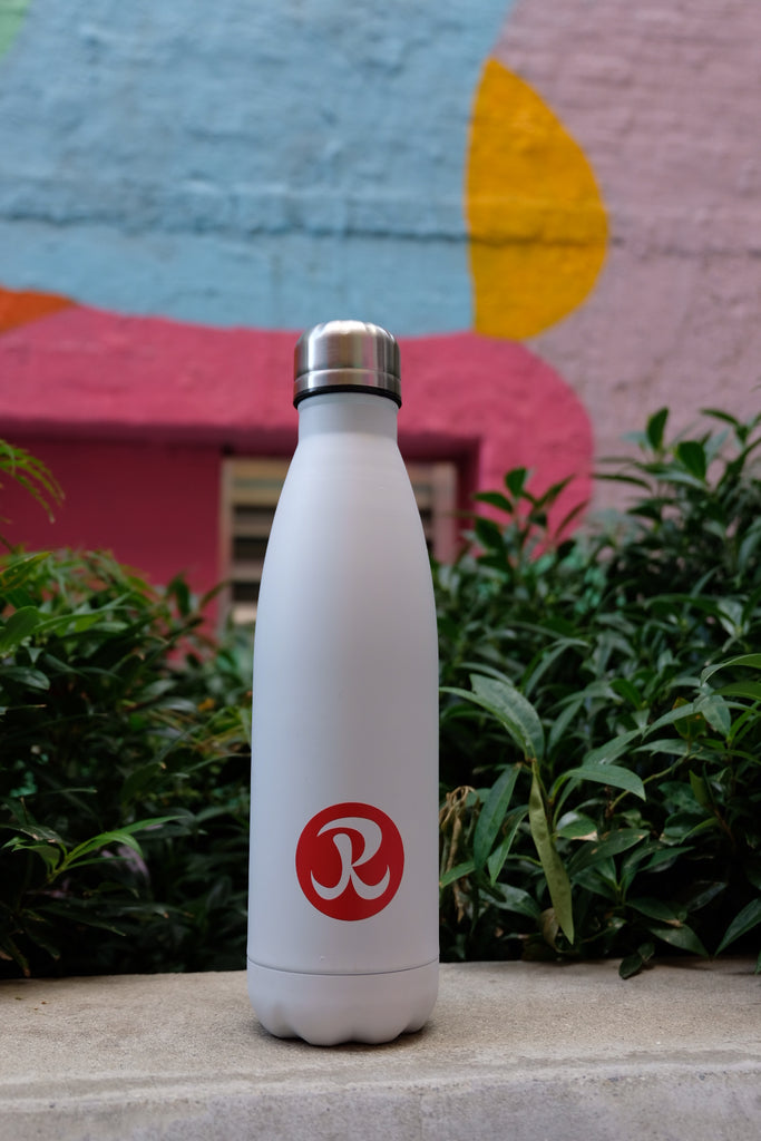 Rhino stainless steel water bottle against colourful outdoor background