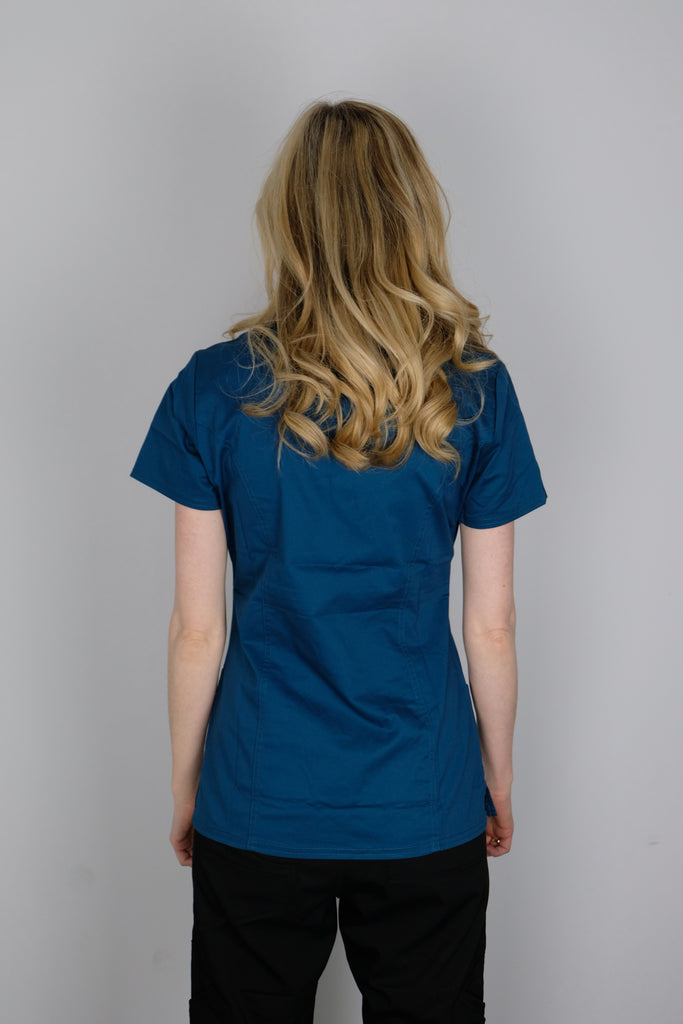 Women's 4-Pocket Curved V-Neck Scrub Top in Caribbean back view on model