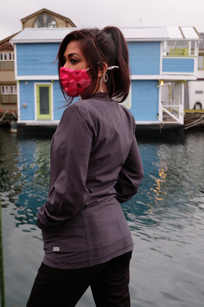 Women's Performance Scrub Jacket in charcoal back view, worn outside by model