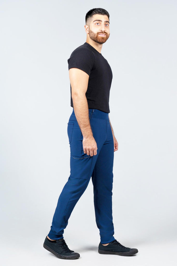 Men's Performance Scrub Jogger in shade navy worn by model with black top side view