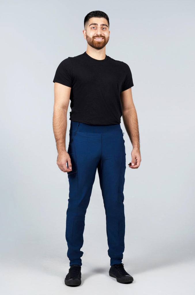 Men's Performance Scrub Jogger in shade navy worn on model with black top front view
