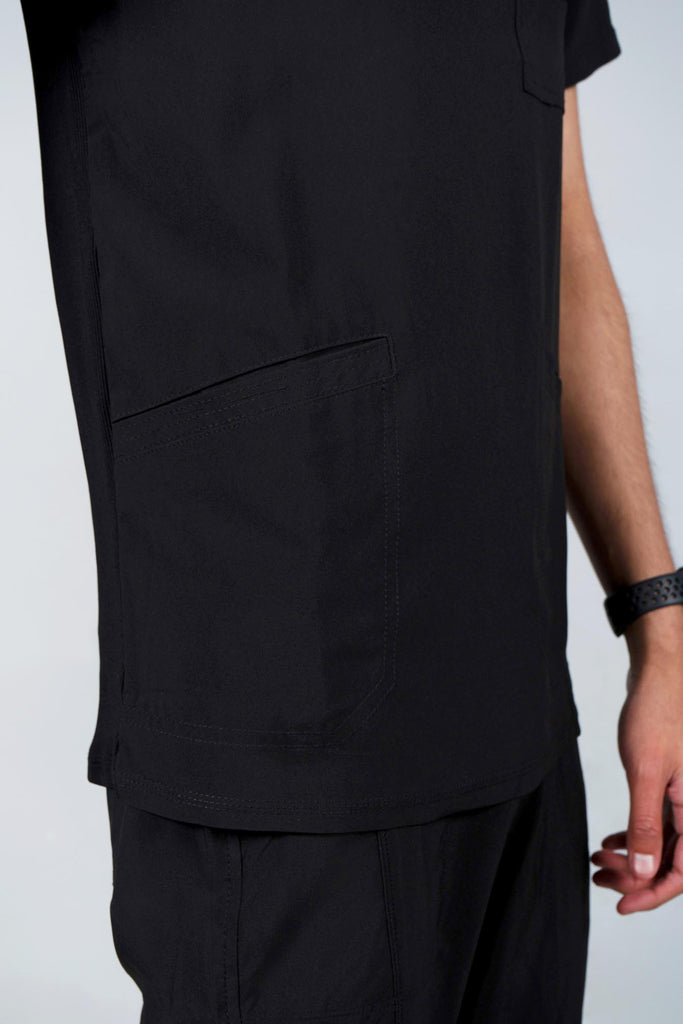 Men's Performance Scrub Top in black closeup on bottom angled pocket