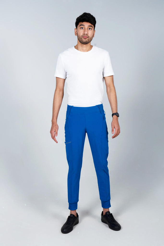 Men's Performance Scrub Jogger in shade royal blue worn by model with white top front view
