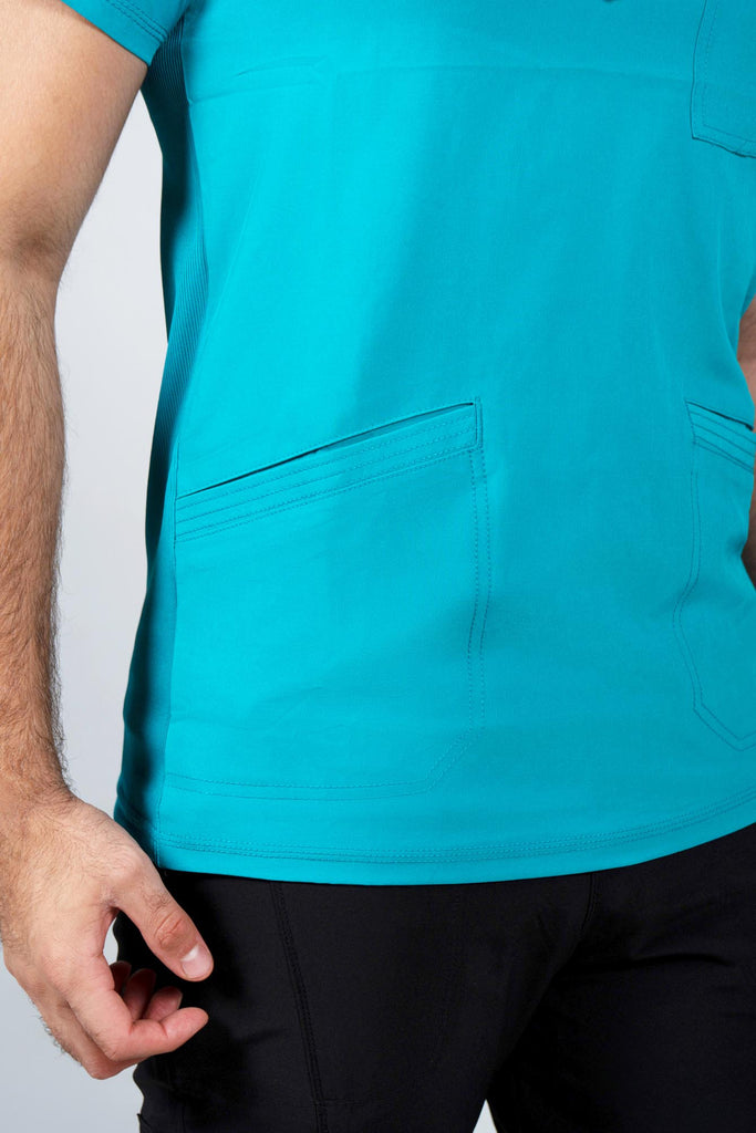 Men's Performance Scrub Top in Teal closeup on bottom angled pocket