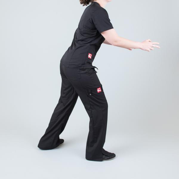 Women’s premium Flex Scrub Pants in shade black shown from side paired with matching flex scrub top in black 