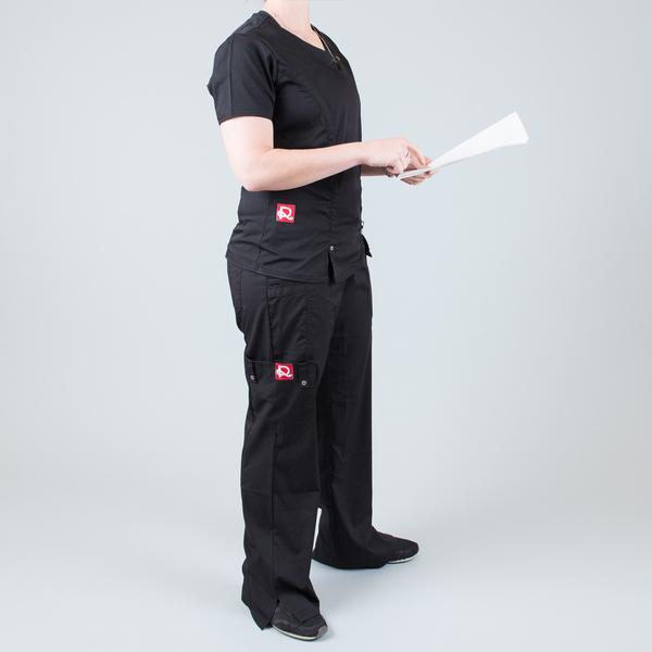 Women’s premium Flex Scrub Pants in shade black shown from side paired with matching scrub set flex top in black