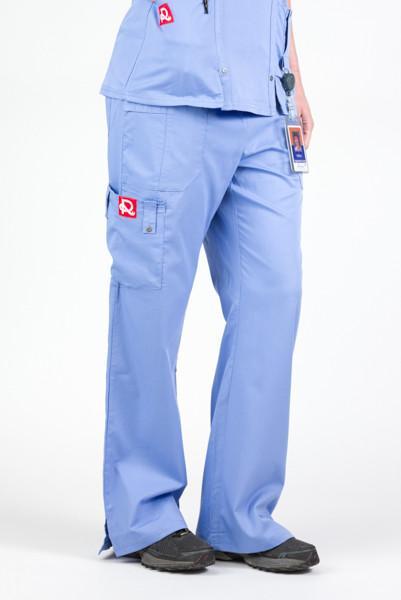 Women’s premium Flex Scrub Pants in shade periwinkle shown from side with logos. Attached id badge hanging from utility loop