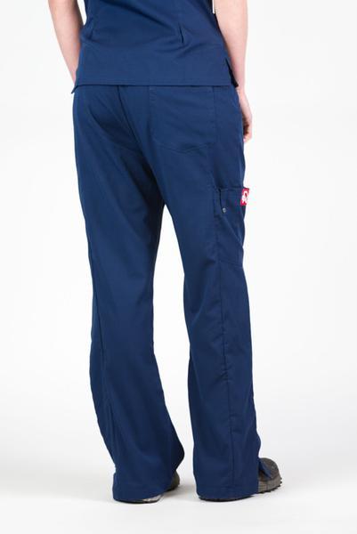 Women’s premium Flex Scrub Pants in shade navy shown from behind paired with matching navy flex scrub top. 