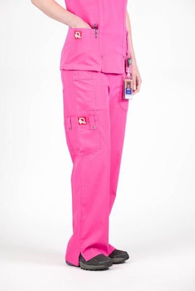 Women’s premium Flex Scrub Pants in shade pink shown from side with logos.