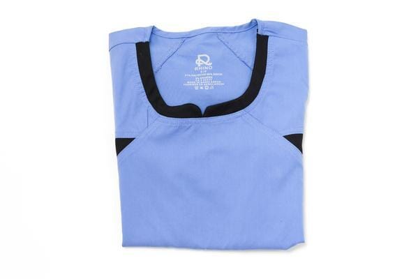 Women's Ultra Flex 4-pocket Scrub Top in periwinkle folded front view