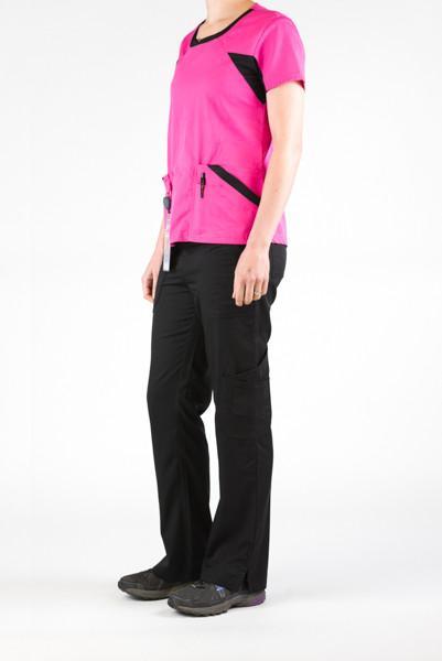 Women's Ultra Flex 4-pocket Scrub Top in pink on model wearing black flex scrub pants side view